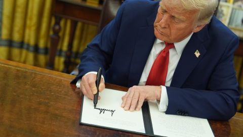 President Donald Trump signs an executive order in the Oval Office of the White House, Monday, Feb. 3, 2025, in Washington. (AP Photo/Evan Vucci)