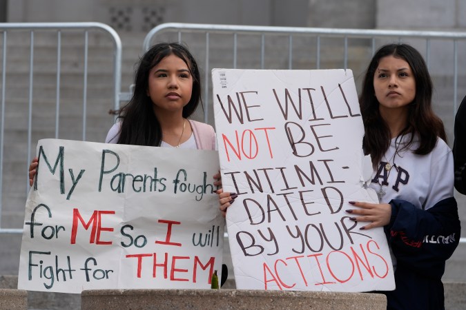 High School students rally to stop President Trump's mass deportations and demand immigration reform in downtown Los Angeles on Friday, Feb. 7, 2025. (AP Photo/Damian Dovarganes)