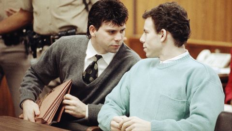 Lyle Menendez, left confers with brother Erik during a court appearance, April 2, 1991 in Beverly Hills, California. Lawyers for the brothers won another delay of a preliminary hearing while they seek a state Supreme Court opinion on whether an alleged murder confession is protected by doctor-patient privilege. (AP Photo/Kevork Djansezian)