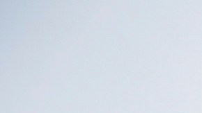 A pedestrian walks in front of the Walt Disney Concert Hall during a rain storm Wednesday, Feb. 5, 2025, in Los Angeles. (AP Photo/Damian Dovarganes)