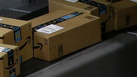 FILE - In this Feb. 9, 2018, file photo packages move down a conveyor system were they are directed to the proper shipping area at the new Amazon Fulfillment Center in Sacramento, Calif. Amazon said Monday, Sept. 14, 2020, that it will be hiring another 100,000 people to keep up with a surge of online orders. The company said the new hires will help pack, ship or sort orders, working in part-time and full-time roles. Amazon said the jobs are not related to its typical holiday hiring. (AP Photo/Rich Pedroncelli, File)