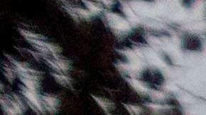 Volunteers from Samaritan's Purse help search a home for items that survived the Eaton Fire, Thursday, Feb. 6, 2025, in Altadena, Calif. (AP Photo/Ethan Swope)