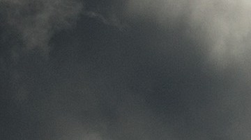 Storm clouds gather over Port of Oakland cranes as viewed from Berkeley, Calif., Monday, Nov. 9, 2015. A storm crossed the region Monday morning, bringing rain, thunder and lightning to the drought-parched region. (AP Photo/Noah Berger)