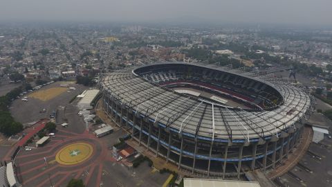 Pollution blankets the sky over the iconic Estadio Azteca and the rest of Mexico City, Thursday, May 16, 2019. A semifinal match between America and Leon that had already been postponed due to air quality will be played out of the city in Queretaro on Thursday. (AP Photo/Rebecca Blackwell)