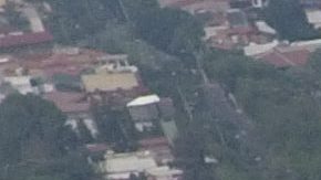 Pollution blankets the sky over the iconic Estadio Azteca and the rest of Mexico City, Thursday, May 16, 2019. A semifinal match between America and Leon that had already been postponed due to air quality will be played out of the city in Queretaro on Thursday. (AP Photo/Rebecca Blackwell)