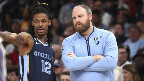 Memphis Grizzlies guard Ja Morant (12) and head coach Taylor Jenkins talk in the first half of an NBA basketball game against the Sacramento Kings, Sunday, Jan. 1, 2023, in Memphis, Tenn. (AP Photo/Nikki Boertman)