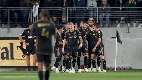 Los Angeles FC forward Denis Bouanga (99) celebrates with teammates after scoring on a penalty kick against Minnesota United during the first half of an MLS soccer match Wednesday, May 29, 2024, in Los Angeles. (AP Photo/Ryan Sun)