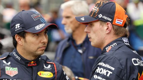 Red Bull driver Max Verstappen of the Netherlands, right, who clocked the fastest time, speaks with Red Bull driver Sergio Perez of Mexico , who clocked the third fastest time during qualification ahead of the Formula One Grand Prix at the Spa-Francorchamps racetrack in Spa, Belgium, Saturday, July 27, 2024. The Belgian Formula One Grand Prix will take place on Sunday. (AP Photo/Geert Vanden Wijngaert)