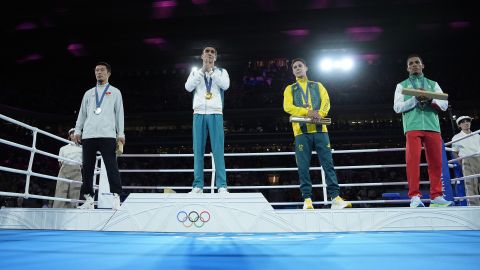 Silver medalist Kyrgyzstan's Munarbek Seiitbek Uulu, from left, gold medalist Uzbekistan's Abdumalik Khalokov, bronze medalists Australia's Charlie Senior and Bulgaria's Javier Ibanez pose during a medals ceremony for the men's 57 kg final boxing match 2024 Summer Olympics, Saturday, Aug. 10, 2024, in Paris, France.(AP Photo/John Locher)