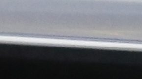 FILE - This Thursday, Feb. 11, 2016, file photo shows the Cadillac logo, a General Motors Co. brand, on display on a vehicle at the Pittsburgh International Auto Show in Pittsburgh. (AP Photo/Gene J. Puskar, File)