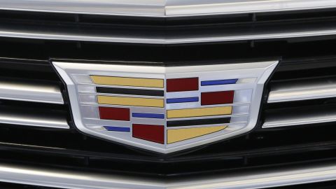 FILE - This Thursday, Feb. 11, 2016, file photo shows the Cadillac logo, a General Motors Co. brand, on display on a vehicle at the Pittsburgh International Auto Show in Pittsburgh. (AP Photo/Gene J. Puskar, File)