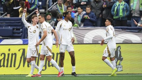 Los Angeles FC forward Nathan Ordaz, left, celebrates with teammates including defender Aaron Long (33) after scoring against the Seattle Sounders during the first half of an MLS soccer match Saturday, March 8, 2025, in Seattle. (AP Photo/Lindsey Wasson)