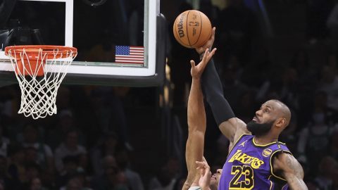 Boston Celtics center Al Horford (42) defends the net on a score attempt by Los Angeles Lakers forward LeBron James (23) during the second half of an NBA basketball game, Saturday, March 8, 2025, in Boston. (AP Photo/Mark Stockwell)
