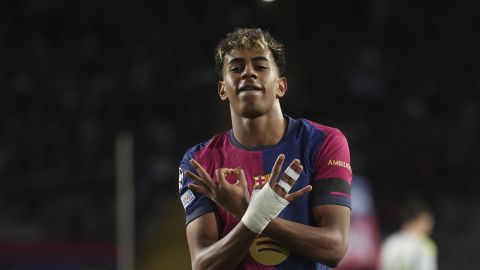 Barcelona's Lamine Yamal celebrates after scoring his side's second goal during the Champions League round of 16 second leg soccer match between FC Barcelona and SL Benfica at the Lluis Companys Olympic Stadium in Barcelona, Spain, Tuesday, March 11, 2025. (AP Photo/Emilio Morenatti)