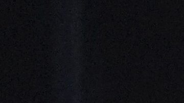 Red Bull driver Liam Lawson of New Zealand reacts in his team garage during the second practice session for the Australian Formula One Grand Prix at Albert Park, in Melbourne, Australia, Friday, March 14, 2025. (AP Photo/Heath McKinley )