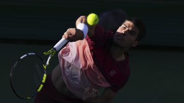 Carlos Alcaraz, of Spain, serves to Jack Draper, of Great Britain, during their semifinals match at the BNP Paribas Open tennis tournament Saturday, March 15, 2025, in Indian Wells, Calif. (AP Photo/Mark J. Terrill)