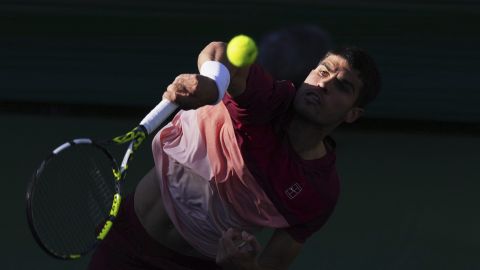 Carlos Alcaraz, of Spain, serves to Jack Draper, of Great Britain, during their semifinals match at the BNP Paribas Open tennis tournament Saturday, March 15, 2025, in Indian Wells, Calif. (AP Photo/Mark J. Terrill)