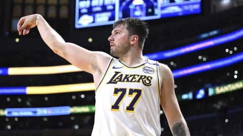 Los Angeles Lakers guard Luka Doncic (77) attempts a three-pointer against the Phoenix Suns in the second half of an NBA basketball game, Sunday, March 16, 2025, in Los Angeles. (AP Photo/Wally Skalij)