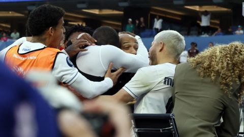 Panama's Cecilio Waterman Ruiz takes former French footballer Thierry Henry in his arm after he jumped on the nearby TV set after scoring against the United States during the second half of a CONCACAF Nations League semifinal soccer match Thursday, March 20, 2025, in Inglewood, Calif. (AP Photo/Etienne Laurent)