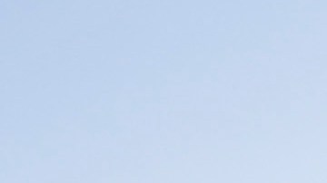 Jose Acuna cleans the Los Angeles Dodgers logo on top of the dugout before a spring training baseball game against the Milwaukee Brewers in Glendale, Ariz., on Sunday, March 8, 2015. (AP Photo/Chris Carlson)