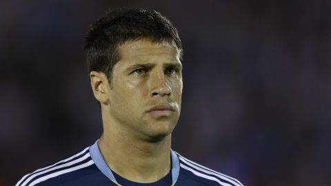 Argentina's Sebastian Dominguez stands on the field before a 2014 World Cup qualifying soccer match against Uruguay in Montevideo, Uruguay, Tuesday, Oct. 15, 2013. (AP Photo/Natacha Pisarenko)