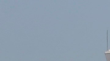 Airplanes sit on the tarmac at Los Angeles International Airport Friday, Nov. 1, 2013. Thousands of fliers were delayed Friday after a shooting in Terminal 3 closed parts of the airport for hours, prompting authorities to evacuate a terminal and stop flights headed for the city from taking off from other airports. Los Angeles police said a suspected gunman has been taken into custody. (AP Photo/Gregory Bull)