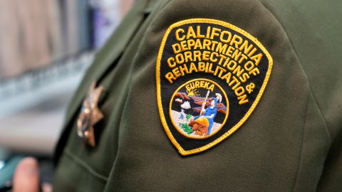 A California Department of Corrections and Rehabilitation patch is seen on the uniform of a deputy warden during a media tour at San Quentin State Prison in San Quentin, Calif., Wednesday, July 26, 2023. In March of 2023 Gov. Gavin Newsom announced California intends to transform the prison into the San Quentin Rehabilitation Center. (AP Photo/Eric Risberg)