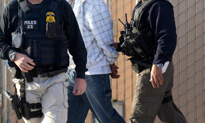 In this March 30, 2012 photo, Immigration and Customs Enforcement (ICE) agents take a suspect into custody as part of a nationwide immigration sweep in Chula Vista, Calif. Federal officials say they arrested more than 3,100 immigrants convicted of serious crimes and fugitives in a six-day nationwide sweep. Officials at U.S. Immigration and Customs Enforcement say the sweep included every state and involved more than 1,900 of the agencys officers and agents. (AP Photo/Gregory Bull)