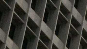 A few people use Grand Park at the foot of Los Angeles City Hall, Tuesday, March 31, 2020, in Los Angeles. The new coronavirus causes mild or moderate symptoms for most people, but for some, especially older adults and people with existing health problems, it can cause more severe illness or death. (AP Photo/Mark J. Terrill)