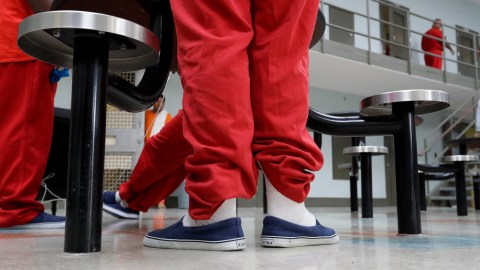 In this Wednesday, Aug. 28, 2019, photo detainees gather in a common area at one of the housing units at the Adelanto ICE Processing Center in Adelanto, Calif. The facility is a privately operated immigration detention center run by the GEO Group, which can house up to about 1900 total immigrant detainees, both male and female. (AP Photo/Chris Carlson)