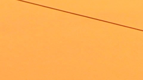 The sun sets above electric poles in Krang Tnung on the outskirts of Phnom Penh, Cambodia, Thursday, Dec. 6, 2012. (AP Photo/Heng Sinith)