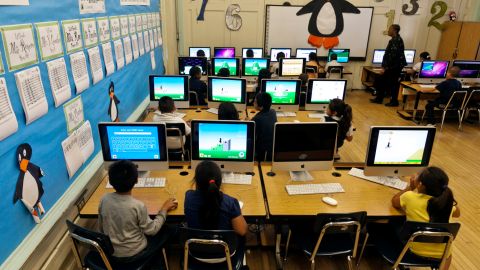 FILE - In this May 15, 2012 file photo, Ritter Elementary School elementary students practice their math skills in Los Angeles. Soaring tax revenues have brought per-pupil education spending in California beyond pre-recession levels, but even the new record sum proposed by Gov. Jerry Brown is unlikely to reverse the states standing as a comparative miser when it comes to investing in public schools, advocates and education officials said. (AP Photo/Damian Dovarganes, File)