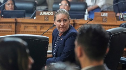 Former Los Angeles Fire Dept. Chief Kristin Crowley looks back at firefighters and union supporters as she appeals for reinstatement as fire chief at city council meeting Tuesday, March 4, 2025, in Los Angeles. (AP Photo/Damian Dovarganes)