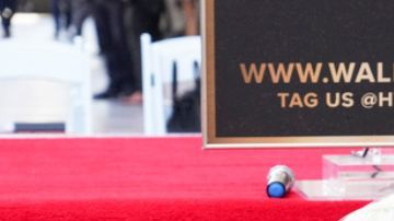 Gal Gadot poses with her new star at a ceremony honoring her on the Hollywood Walk of Fame on Tuesday, March 18, 2025, in Los Angeles. (Photo by Jordan Strauss/Invision/AP)