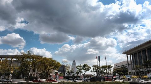 Storm clouds pass over Los Angeles City Hall on Monday, Feb. 12, 2018. It looked and felt like winter on Monday as clouds filled the sky and temperatures cooled in Southern California, but just about the only thing that fell was expectation for much rain in the drought-stricken region. (AP Photo/Richard Vogel)