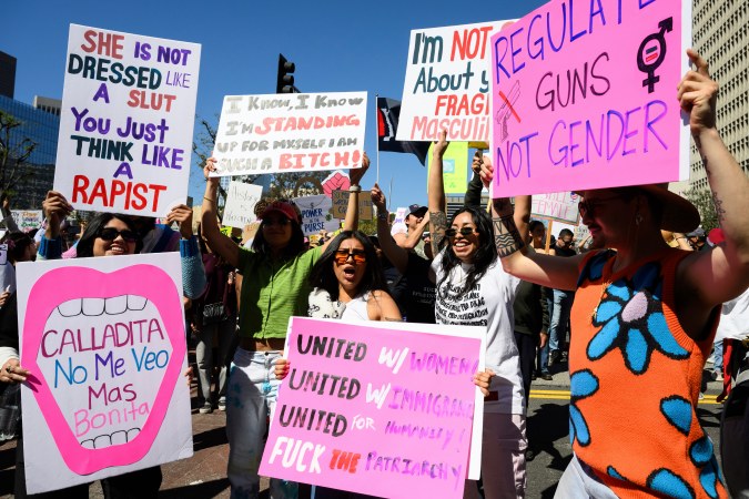Demonstrators cheer during a march to commemorate International Women's Day Saturday, March 8, 2025, in Los Angeles. (AP Photo/William Liang)