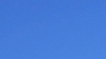Debris from a home destroyed by the Palisades Fire is seen next to a home still standing in Malibu, Calif., Sunday, Jan. 12, 2025. (AP Photo/Mark J. Terrill)