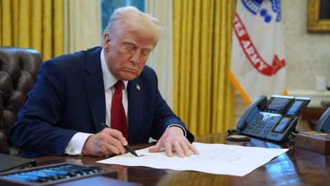 FILE - President Donald Trump signs a document in the Oval Office at the White House, Jan. 30, 2025, in Washington. (AP Photo/Evan Vucci, File)