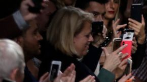 Actress Jennifer Lopez, left, and designer Donatella Versace accept applause at the conclusion of the Versace Spring-Summer 2020 collection, unveiled during the fashion week, in Milan, Italy, Friday, Sept. 20, 2019. (AP Photo/Luca Bruno, File)