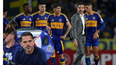 Coach Fernando Gago of Argentina's Boca Juniors, right, together with his players leave the field at the end of the first half of a Copa Libertadores soccer match against Peru's Alianza Lima at La Bombonera stadium in Buenos Aires, Argentina, Tuesday, Feb. 25, 2025. (AP Photo/Gustavo Garello)