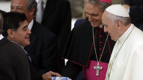 FILE - In this Monday, Sept. 1, 2014 file photo, Diego Armando Maradona, left, greets Pope Francis in the Paul VI hall at the Vatican, ahead of an inter-religious match for peace. Diego Maradona has died. The Argentine soccer great was among the best players ever and who led his country to the 1986 World Cup title before later struggling with cocaine use and obesity. He was 60. (AP Photo/Gregorio Borgia, File)