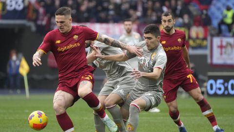 Roma's Nicolo Zaniolo, left, challenges for the ball with Genoa's Johan Vasquez during the Italian Serie A soccer match between Roma and Genoa at Rome's Olympic stadium, Saturday, Feb. 5, 2022. (AP Photo/Gregorio Borgia)