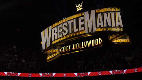 FILE - A WrestleMania sign hangs over the crowd during the WWE Monday Night RAW event, Monday, March 6, 2023, in Boston. WWE is flexing its branding muscle, selling more than 90,000 tickets to next year's WrestleMania about eight months before the premium live event is held and before a single match has been announced. (AP Photo/Charles Krupa, FIle) FILE - A WrestleMania sign hangs over the crowd during the WWE Monday Night RAW event, Monday, March 6, 2023, in Boston. WWE is flexing its branding muscle, selling more than 90,000 tickets to next year's WrestleMania about eight months before the premium live event is held and before a single match has been announced. (AP Photo/Charles Krupa, FIle)