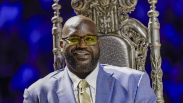 Shaquille O'Neal listens to presenters as his Orlando Magic jersey number is retired, after the Magic's NBA basketball game against the Oklahoma City Thunder, Tuesday, Feb. 13, 2024, in Orlando, Fla. (AP Photo/Kevin Kolczynski)