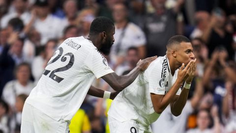 Real Madrid's Kylian Mbappe, right, celebrates with teammate Antonio Rudiger after scoring the opening goal during the Champions League opening phase soccer match between Real Madrid and VfB Stuttgart at the Santiago Bernabeu stadium, in Madrid, Tuesday, Sept. 17, 2024. (AP Photo/Manu Fernandez)