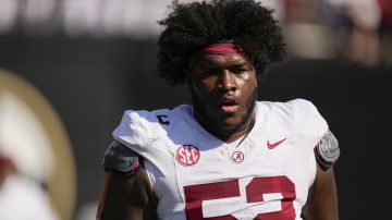 Alabama offensive lineman Tyler Booker before an NCAA college football game against Vanderbilt, Saturday, Oct. 5, 2024, in Nashville, Tenn. (AP Photo/George Walker IV)