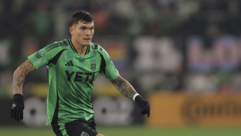 Austin FC forward Brandon Vázquez, left, looks to drive past Sporting Kansas City midfielder Nemanja Radoja (6) during an MLS soccer match, Saturday, Feb. 22, 2025, in Austin, Texas. (AP Photo/Stephen Spillman)