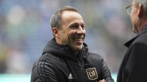 Los Angeles FC head coach Steve Cherundolo talks with Seattle Sounders head coach Brian Schmetzer, right, before an MLS soccer match Saturday, March 8, 2025, in Seattle. (AP Photo/Lindsey Wasson)
