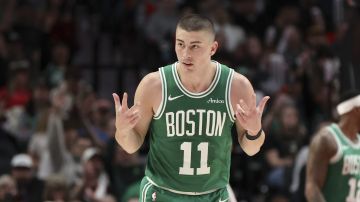 Boston Celtics guard Payton Pritchard reacts after making a 3-point basket against the Portland Trail Blazers during the first half of an NBA basketball game Sunday, March 23, 2025, in Portland, Ore. (AP Photo/Amanda Loman)