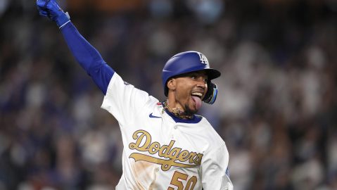 CORRECTS TO DELETE AN EXTRANEOUS PHRASE OF OPENING-DAY - Los Angeles Dodgers shortstop Mookie Betts celebrates as he runs to first after hitting a walk-off three-run home run during the 10th inning of a baseball game against the Detroit Tigers Friday, March 28, 2025, in Los Angeles. (AP Photo/Mark J. Terrill)